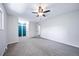 Main bedroom with gray carpet and spacious closet at 3806 S Yosemite St, Denver, CO 80237