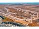 Aerial view of a new housing development under construction with roads and foundations at 595 Twilight St, Erie, CO 80516
