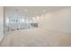 Spacious loft area with neutral carpeting, recessed lighting, and a view of the lower level at 595 Twilight St, Erie, CO 80516
