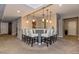 Basement bar area with seating for eight, pendant lighting, and neutral tones at 15804 Elizabeth Cir, Brighton, CO 80602