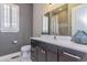 Modern bathroom featuring dark cabinets, a white countertop, and a stylish vessel sink at 15804 Elizabeth Cir, Brighton, CO 80602