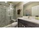 Bathroom with a glass enclosed shower, neutral countertops, and modern fixtures at 15804 Elizabeth Cir, Brighton, CO 80602