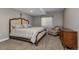 Bedroom featuring a comfortable bed, chaise lounge, and dresser at 15804 Elizabeth Cir, Brighton, CO 80602
