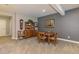 Dining room with wooden table, hutch and chairs, carpeted floor, and neutral paint at 15804 Elizabeth Cir, Brighton, CO 80602