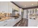 Gourmet kitchen with stainless steel appliances and a large center island with bar seating at 15804 Elizabeth Cir, Brighton, CO 80602