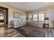 Bright living room featuring neutral paint, hardwood floors, and natural light at 15804 Elizabeth Cir, Brighton, CO 80602