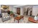 Cozy living room with plush seating, decorative accents, and staircase access to upper level at 15804 Elizabeth Cir, Brighton, CO 80602