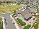 Aerial shot of a home featuring a firepit and a covered porch, situated in a residential neighborhood at 15804 Elizabeth E Cir, Thornton, CO 80602