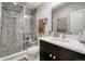 Modern bathroom with marble walk-in shower, stone flooring, and modern vanity at 15804 Elizabeth E Cir, Thornton, CO 80602