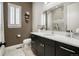 Stylish bathroom with marble countertop vanity, modern fixtures, and a tiled shower, offering a serene and elegant space at 15804 Elizabeth E Cir, Thornton, CO 80602