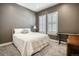 Bright bedroom with neutral walls, plush carpeting, and elegant white shutters, perfect for relaxation and comfort at 15804 Elizabeth E Cir, Thornton, CO 80602