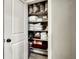 Linen closet featuring shelving with plenty of linens, pillows, and towels at 15804 Elizabeth E Cir, Thornton, CO 80602