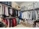 Walk-in closet features clothing racks, storage boxes, and plenty of storage space at 15804 Elizabeth E Cir, Thornton, CO 80602
