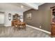 Basement dining area with a round table, chairs, and built-in cabinets at 15804 Elizabeth E Cir, Thornton, CO 80602