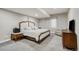 Comfortable bedroom with a decorative headboard, neutral carpet, and soft lighting, providing a relaxing retreat at 15804 Elizabeth E Cir, Thornton, CO 80602