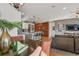 Dining area with table and chairs, adjacent to kitchen and living room at 19836 W 93Rd Ave, Arvada, CO 80007