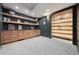 Finished basement with custom built-ins, floating shelves, and a climate-controlled wine cellar at 2475 S Adams St, Denver, CO 80210