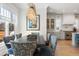 Dining room with a dark wood table and fabric upholstered chairs, next to the kitchen at 2475 S Adams St, Denver, CO 80210