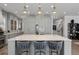 Stunning kitchen featuring an island with marble counters, seating, and designer pendant lighting at 2475 S Adams St, Denver, CO 80210