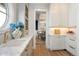 Bright kitchen with marble counters, gold faucet, and open access to the dining room at 2475 S Adams St, Denver, CO 80210