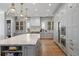 Spacious kitchen with a large marble island, custom cabinets, and stainless steel appliances at 2475 S Adams St, Denver, CO 80210