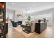 Spacious living room with fireplace, hardwood floors, neutral tones, and large windows for natural light at 2475 S Adams St, Denver, CO 80210