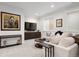 Cozy living room features a large TV, comfortable seating, and neutral decor at 2475 S Adams St, Denver, CO 80210