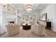 Open living room with coffered ceiling, modern furnishings, fireplace, and natural light at 2475 S Adams St, Denver, CO 80210