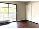 Bedroom features sliding glass doors to balcony and ample closet space at 18064 E Ohio Ave # 202, Aurora, CO 80017