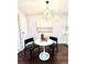 Charming dining area with modern light fixture, offers an inviting space for meals and gatherings at 18064 E Ohio Ave # 202, Aurora, CO 80017