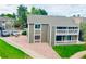Exterior view of home showing parking, landscaping, and private balcony at 18064 E Ohio Ave # 202, Aurora, CO 80017