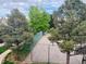 Community park view featuring mature trees, a walking path, and landscaping at 18064 E Ohio Ave # 202, Aurora, CO 80017