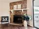 A charming stone fireplace anchors the living room, providing warmth and a rustic touch at 18064 E Ohio Ave # 202, Aurora, CO 80017