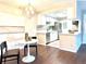 Eat-in kitchen boasts a stainless dishwasher and seamless flow to the dining area, perfect for modern living at 18064 E Ohio Ave # 202, Aurora, CO 80017