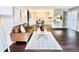 Cozy living room offers open layout, stylish décor, and seamless flow to the dining area and kitchen at 18064 E Ohio Ave # 202, Aurora, CO 80017