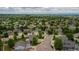Aerial view of a residential neighborhood with mature trees and green spaces at 5286 Rustic Ave, Firestone, CO 80504