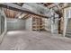 Unfinished basement featuring open ceilings and concrete flooring at 5286 Rustic Ave, Firestone, CO 80504