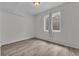 Basement room with vinyl floors and a single window at 5286 Rustic Ave, Firestone, CO 80504