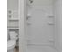 Bright bathroom with a shower and built in shelves at 5286 Rustic Ave, Firestone, CO 80504
