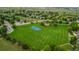 Aerial view of a community park with a basketball court and grassy field at 5286 Rustic Ave, Firestone, CO 80504