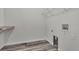 Clean laundry room with modern flooring and built in shelving at 5286 Rustic Ave, Firestone, CO 80504