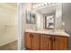 Main bathroom with double vanity, bright lighting, and convenient access to the walk-in closet and bedroom at 4307 Beautiful Cir, Castle Rock, CO 80109