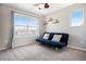 Bedroom with a blue futon, a large window and carpeted floors at 4307 Beautiful Cir, Castle Rock, CO 80109