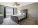 Bedroom features a large window, ceiling fan, and carpeted floors at 4307 Beautiful Cir, Castle Rock, CO 80109