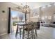 Dining area with a modern table, natural light, and views of the backyard at 4307 Beautiful Cir, Castle Rock, CO 80109