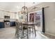 Bright dining area with a modern table, stylish decor, and a view of the backyard at 4307 Beautiful Cir, Castle Rock, CO 80109