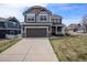 Charming two-story home with a two-car garage, landscaped yard, and classic curb appeal at 4307 Beautiful Cir, Castle Rock, CO 80109