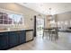 Bright kitchen boasts modern appliances, sleek countertops, and an adjacent dining area with backyard access at 4307 Beautiful Cir, Castle Rock, CO 80109