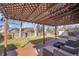 Wooden backyard deck with decorative pergola and outdoor seating at 9749 Meade Cir, Westminster, CO 80031