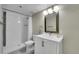 Beautiful bathroom features a shower and a modern vanity with ample lighting at 9749 Meade Cir, Westminster, CO 80031